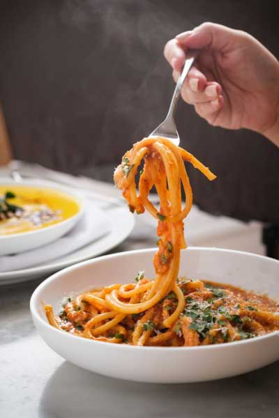 Two students sitting at table enjoying a meal
